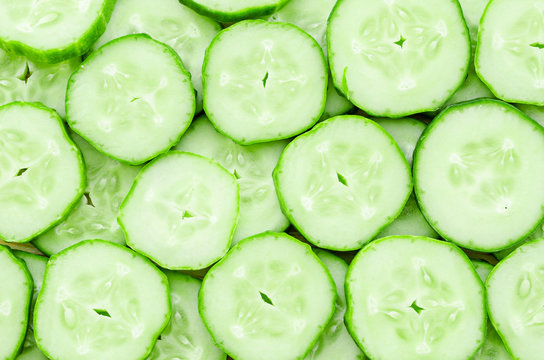Close up of fresh cucumber slices background