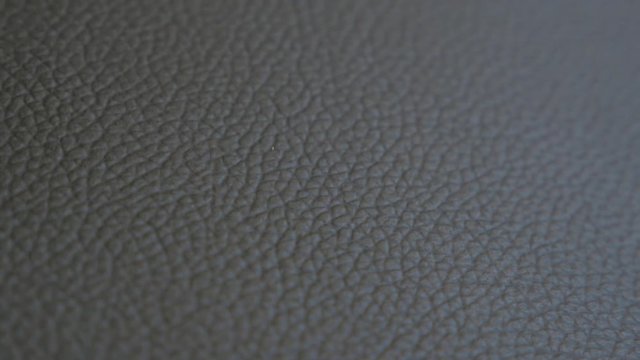 Shallow DOF leather texture 4K 2160p UHD panning footage - Leather texture close-up 4K 3840X2160 UHD video