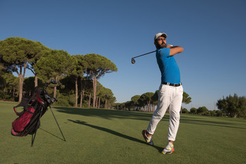 golf player hitting shot