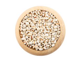 Raw millet rice in wooden dish on white background.