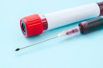Fototapeta premium Macro view of drop of blood from syringe.