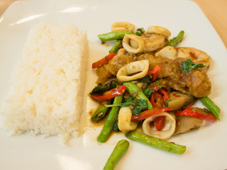 Rice with stir-fried seafood and basil