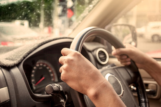 Hands On Steering Wheel Of Car Driving In Vintage Color Tone