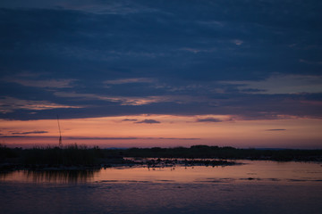 Fototapeta na wymiar Sunrise on the lake with beautiful sky