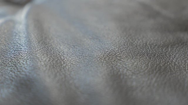 Real leather sofa shallow DOF panning 4K 3840X2160 UHD footage - Leather contemporary dark sofa 4K 2160p UHD video