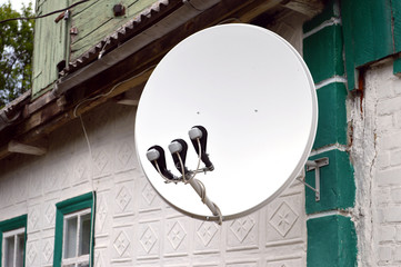satellite dish attached to the wall