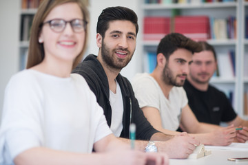 group of students study together in classroom