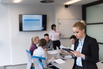 business woman working on tablet at meeting room