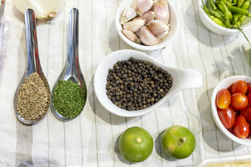 Fruits, herbs and spices use for cooking Thai food, lemon, paprika, garlic, tomatoes.