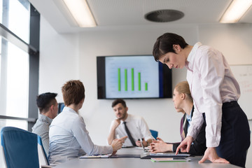 young  woman using  tablet on business meeting