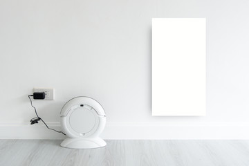 Mock up white discard with Cleaning robot charging at white wall