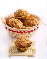 Carrot and raisin muffins on table