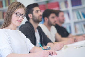 group of students study together in classroom