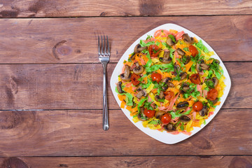Colored pasta with mushrooms, tomatoes and cheese