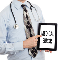 Doctor holding tablet - Medical error