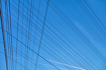 Fototapeta na wymiar Plurality of electrical wire against the bkue sky