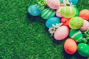 Colorful easter eggs on green grass