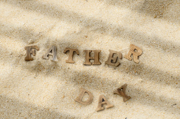 Happy father day concept, word of wooden father day on wood on beach background idea