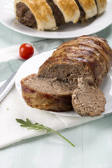 Minced meatloaf wrapped in puff pastry
