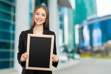 Fototapeta premium Beautiful happy smiling woman showing copy space