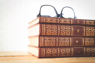 reading glasses with books on the table