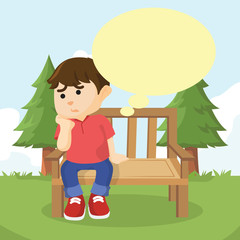 boy sitting on bench thinking