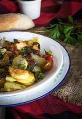 Fried potato with onion and parsley