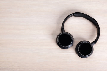 headphones on wooden background