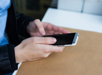 woman holding her smartphone