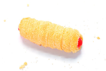 Cream filled pastry roll on white background