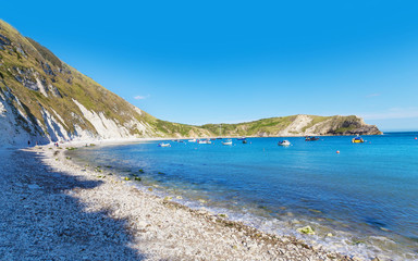 Popular Lulworth Cove Atlantic ocean coast, Dorchester, England,