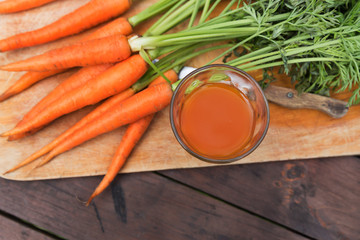 Fresh carrot juice crop in garden