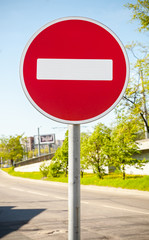 Round red road sign on metal pole. No Entry