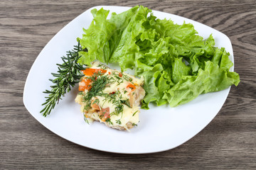Meat covered cheese and tomato