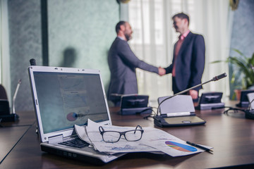 handshake on business meeting at office at the conclusion of the contract