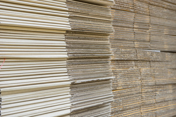 stack of corrugated cardboard boxes. egde view of flattened boxe
