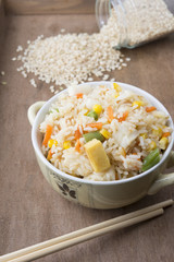 Rice with vegetables on white background
