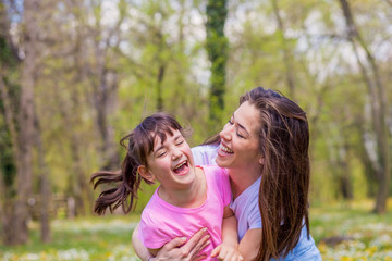 Fototapeta premium Mother with daughter in park 