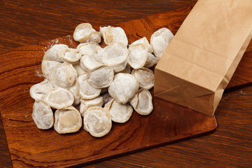 Tortellini on a wooden table