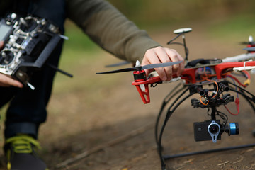 Closeup of man hand fixing propeller drone 