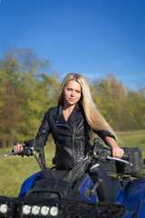 Fototapeta na wymiar Elegant woman riding ATV