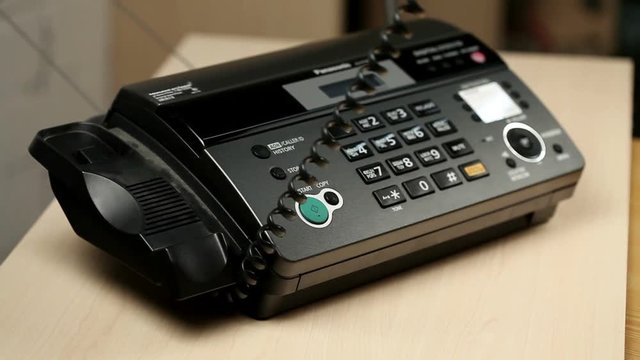 Close-up shot of man's hands which is calling by telephone.