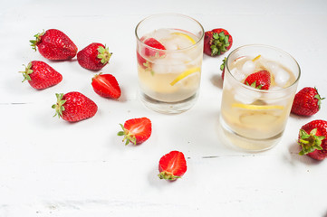 homemade lemonade on a white wood background