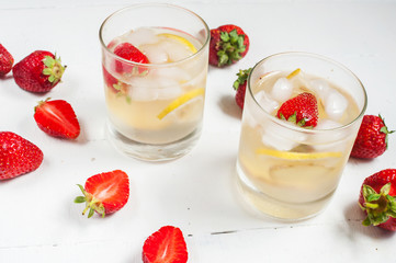 homemade lemonade on a white wood background
