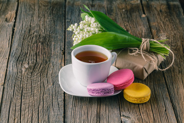 Tea cup with White flower decoration on wooden table