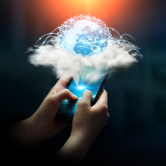 Digital world in a cloud connected to businesswoman mobile phone