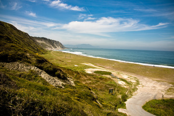 picturesque azkorri sandy beach by the atlantic cornice, basque country, spain