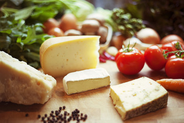 Selection of cheese and fresh vegetables