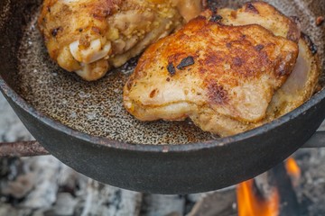  Fried chicken meat . prepare on fire . On a frying pan . to fry meat . Tasty and appetizing