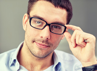 portrait of businessman in eyeglasses at office